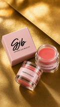Golden Jas Beauty Lip Balm product with pink packaging on gold background